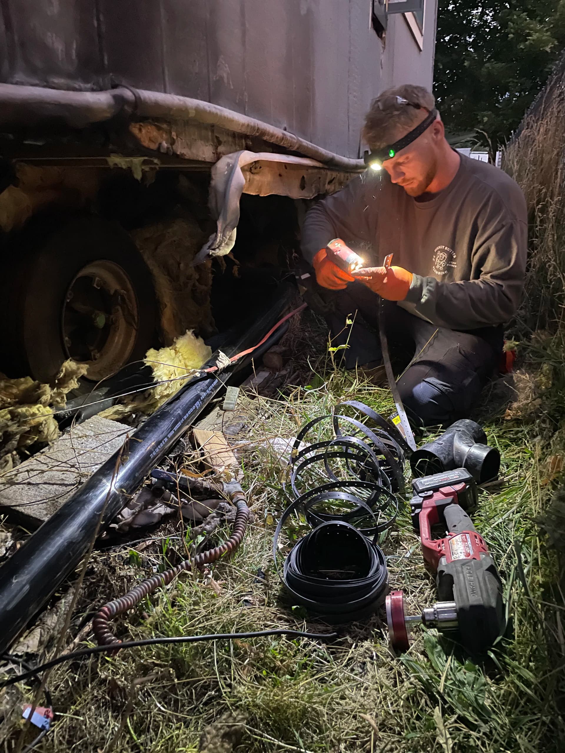 Gallery photos for Sewer and Water Main Repair Under a Fire-Damaged Trailer in Salt Lake: Image #1