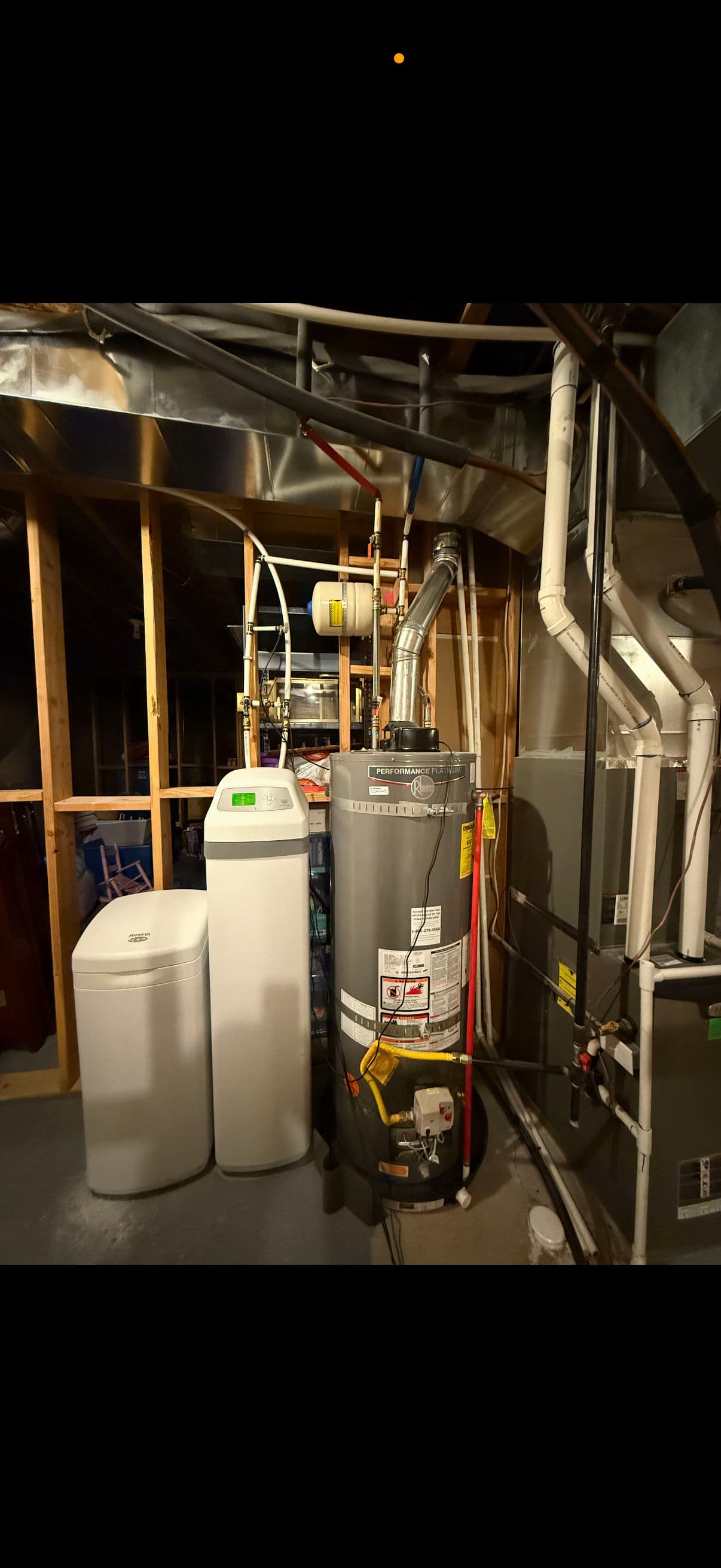 Old Tank Water Heater and Softener Swapped for a Tankless Upgrade image
